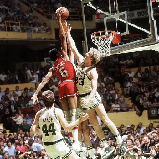 Julius Erving (Dr. J) dunking on Larry Bird